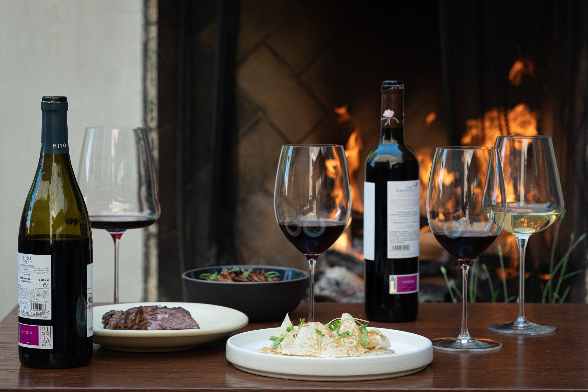 Ribera del Duero reds and a Rueda white by the fire, with steak and tapas